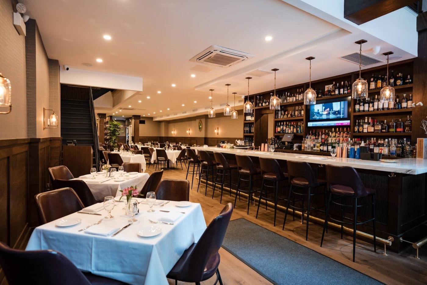 The warm dining room and bar at Delbianco Italian Restaurant